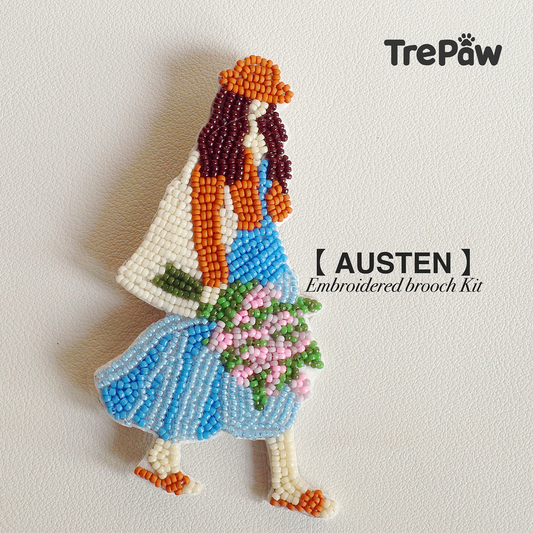 Austen bead embroidery kit - a girl in blue dress with orange coat and bouquet