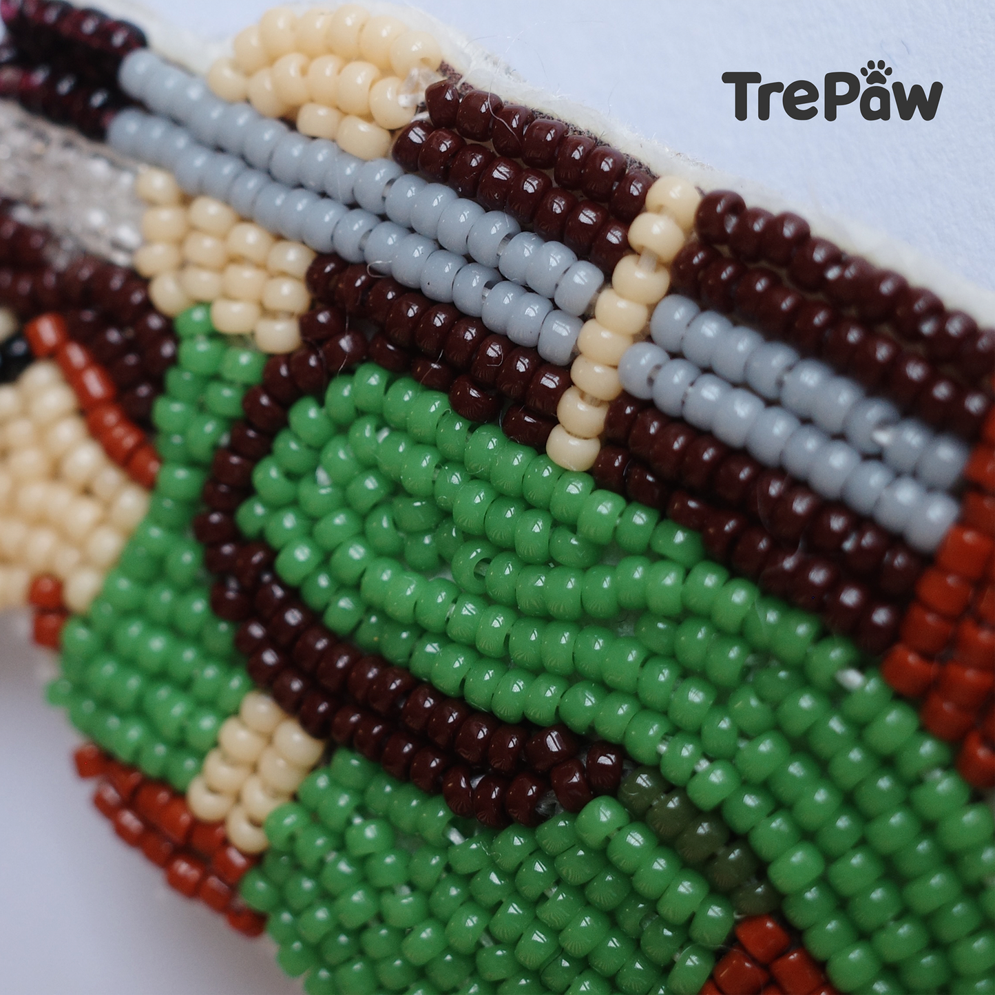 Close-up of Hiker bead embroidery showing the backpack, trekking poles and hiking outfit