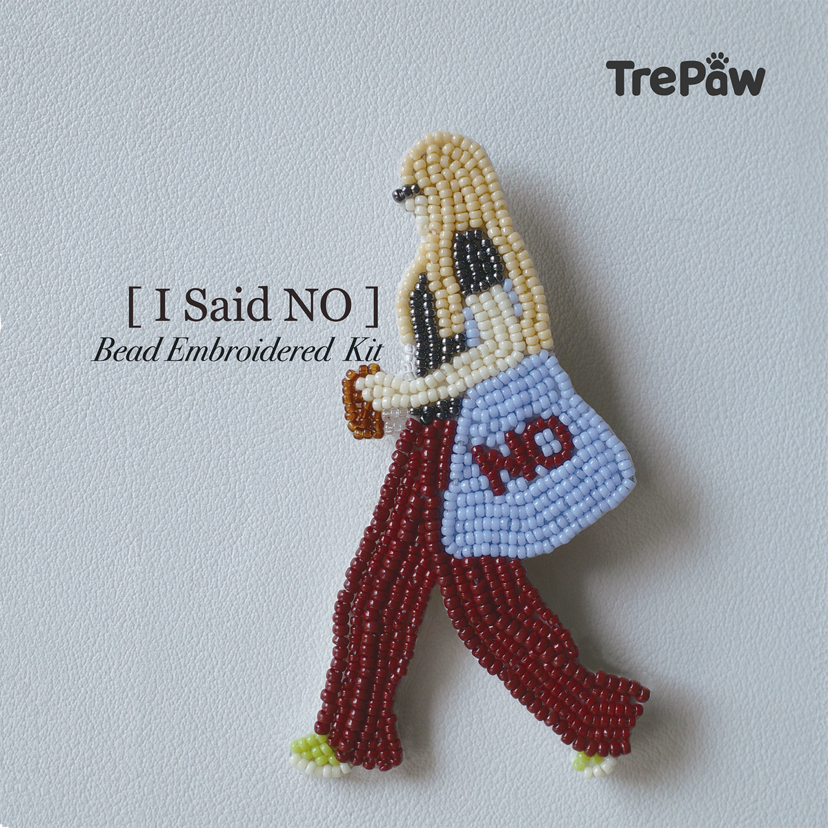 I Said No DIY bead embroidery kit featuring a confident girl in a metallic top and wine-red trousers