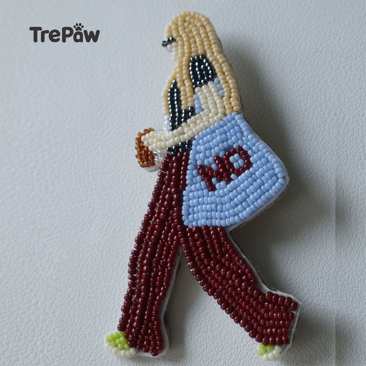 finished piece hanging on a bag, bold accessory for everyday style