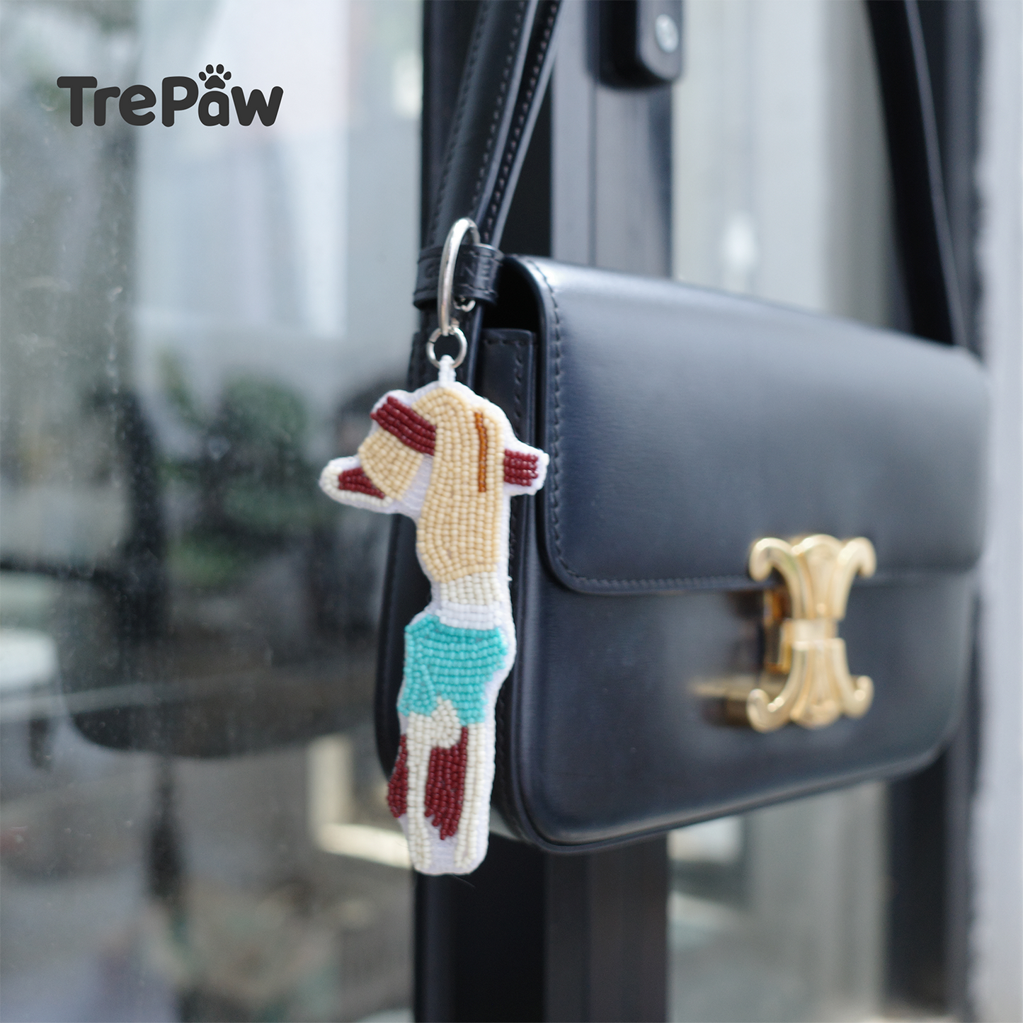Lazy Sunday upside down girl beaded charm hanging from a bag