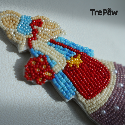 Close-up of Poppy Cream bead embroidery showing the red flower bouquet, blonde ribbon and lavender dress