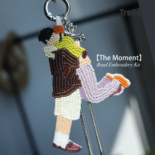 The Moment DIY bead embroidery kit featuring a couple sharing a warm embrace