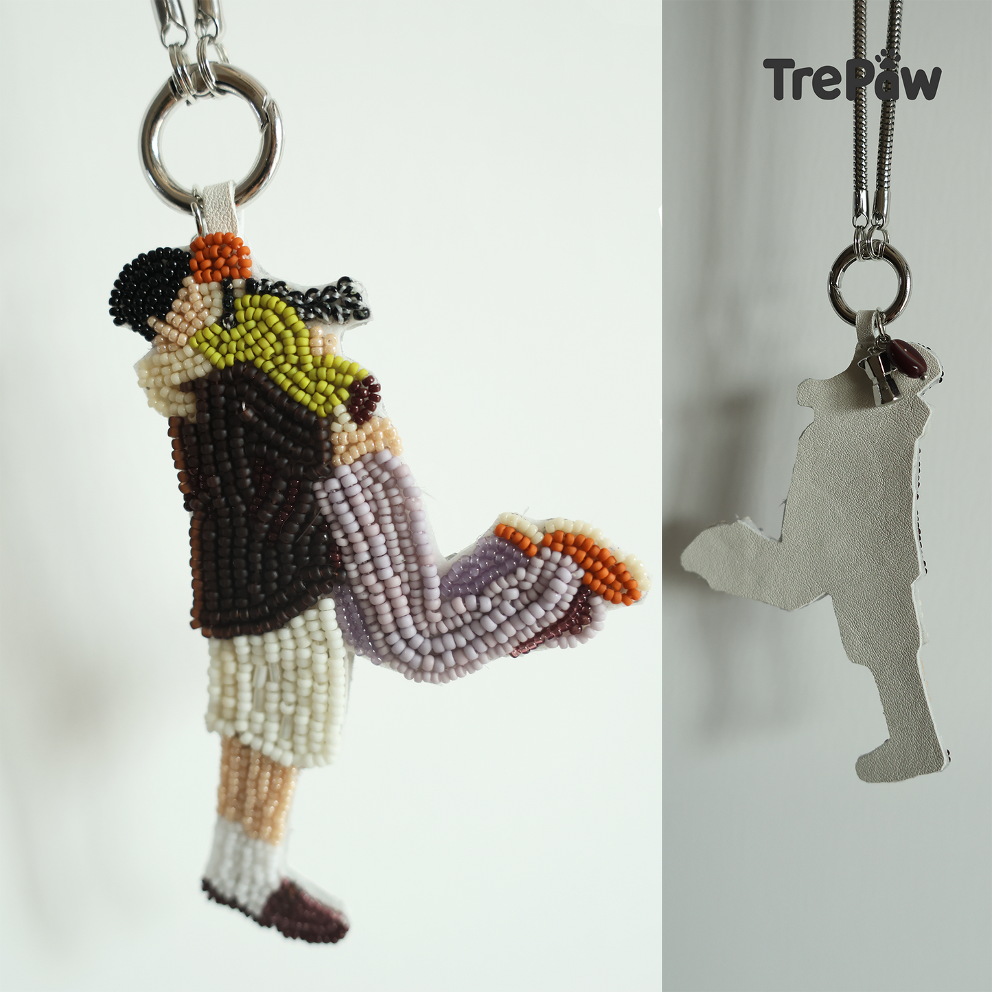 The Moment couple beaded charm hanging from a bag