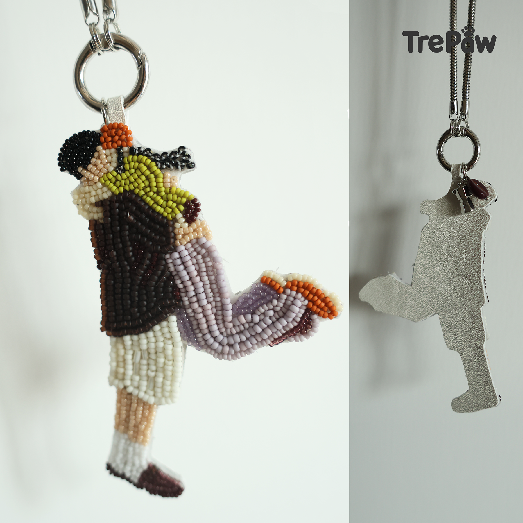 The Moment couple beaded charm hanging from a bag