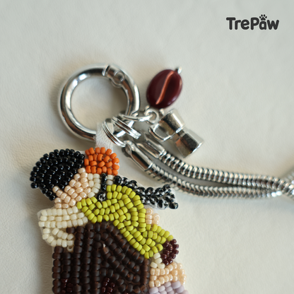 Close-up of The Moment bead embroidery showing two people embracing